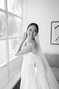 Bride smiling while getting ready