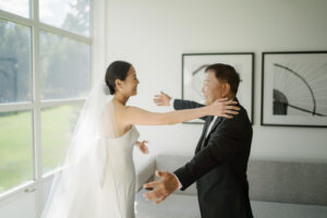 Bride hugs father at Aspen Meadows