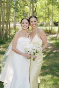Bride and friend at summer Colorado wedding