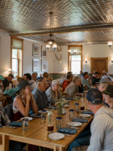 Guests enjoying family dinner at Dunton Hot Springs 